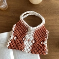 Detailed close-up of handmade woven tote bag with brown and cream diamond crochet patterns - Orange