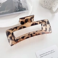 Large leopard print square hair claw clip in amber finish on a clean white desk - 12.5CM / Light Coffee Large