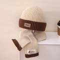 Detail of soft cream knitted winter hat and scarf set with dark brown ribbed edges - Set / Off White