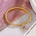 Goldenes Perlenarmband mit süßem Bärenanhänger und einem leuchtenden lila Zirkoniastein - 31554-Gold Violetter Zirkonia