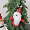 Handmade Santa Claus plush ornament hanging on a Christmas tree with festive lights - Red Santa Claus Hanging Ornament 18cm