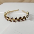 Detailed view of purple marquise crystal hairband with gold wire wrap design - Navette Rose Red Style
