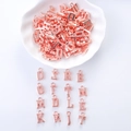 Detail of rose gold alphabet letter charms arranged on a white scalloped plate and background - Letter Pendant with Ring 2 Rose Gold