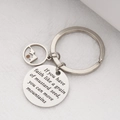 Macro shot of stainless steel Faith keychain with engraved quote and mustard seed charm - Keychain