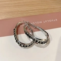 Macro detail of silver double-layered oval hoop earrings with micro-set black zircons - Double Layer Oval with Black Trim (E1826 Black) / 925 Silver Needle / Silver/Black