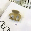 Detail of khaki resin hair claw clip with Barrette La France engraving on a magazine - Approx 6cm / Khaki