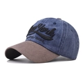 Detail of embroidered New York text on vintage washed canvas baseball cap with suede brim - Adjustable / Navy Blue