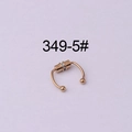 Rose gold magnetic fake septum ring with ball ends on a purple background - Rose Gold