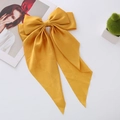 Detailed texture of ginger yellow satin bow hair clip with flowing long ribbons - Yellow Long Streamer