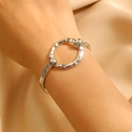 Detail shot of silver geometric bangle with hammered texture on silk fabric background - Silver Round Hammered (8185)