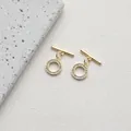 Detailed macro view of a 14K gold plated OT toggle clasp set with shimmering zircon stones - Style B Round Zirconia / 14K Gold