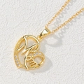 Close-up of heart-shaped gold necklace pendant with Mom lettering and zircon stones - Gold Heart Mom Pendant/Diamond-Set Craft