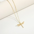 Macro view of gold dragonfly pendant necklace with sparkling white cubic zirconia stones - Small Dragonfly
