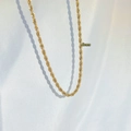 Close-up of 5mm gold chunky rope chain necklace draped on elegant white silk fabric - Single Layer Style (CDK179) / 5mm Width