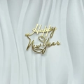 Goldener Acryl Happy New Year Kuchendekoration auf strukturiertem Hintergrund für Partys - Frohes Neues Jahr A Gold
