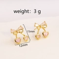 Detail view of pink heart crystal cherry earrings with size dimensions and weight info - Gold