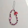 Pink and black beaded phone charm with red velvet bow and heart-shaped pendant - Red Bow Phone Chain
