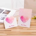 Pink stereoscopic heart greeting card with Best Wishes text on a wooden desk - Best Wishes / Rose Pink