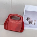 Modern red acrylic trapezoid handbag with ribbed horizontal cutouts and integrated handle - Red
