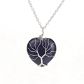 Macro shot of silver wire-wrapped Tree of Life on heart-shaped blue sand stone pendant - Silver + Blue Sandstone