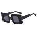 Oversized square black sunglasses with unique 3D honeycomb textured frames in 45-degree view - Black Frame Grey Lens