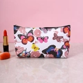 Chic white makeup bag with colorful butterfly prints and black zipper on marble surface - White Butterfly