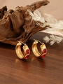 Chic gold hoop earrings with baguette-cut red zircons displayed on a rustic wood surface - ZHE986 Style - Red Rhinestone / 18K Gold
