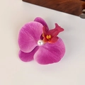 Detailed shot of pink orchid fabric hair claw with fiber texture and white pearl center - Purple Orchid with Pearl (Small Duckbill Clip)