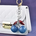 Sweet blue glitter cherry keychain with red leaves on white quilted handbag - Blue Cherry