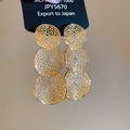 Close-up of triple layered hollow gold circular drop earrings on a black jewelry display card - Copper/925 Silver Pin / Gold