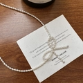 Élégant collier en argent S925 avec petites perles blanches au design de nœud délicat - Argent 925 / Type B Style Perle Naturelle