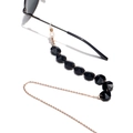 Detail of black faceted crystal beads on a gold metal eyeglass chain with rubber loops - Black
