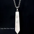 Macro detail of a large 5x1cm white crystal hexagonal point pendant with silver chain - Large White Crystal