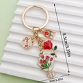 Golden metal keychain with red rose, tulip, and mama charms for bag decoration - Red Rose Bouquet (ER1550)