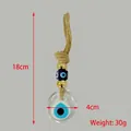 Detailed view of 18cm Turkish Evil Eye wall hanging with golden beads and jute rope - Gold Bead Transparent Circle