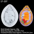 Silicone mold for vintage birdcage pendants showing white mold and purple sample - Birdcage Rose Style (17-237) / Clear