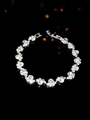 Sparkling silver cluster bracelet with round zircon stones on reflective black background - Silver Rhinestone Cluster