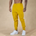 Detail view of yellow jogger pants featuring drawstring waistband and functional side pockets - Yellow