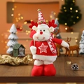 Detail of Christmas reindeer plush doll with knitted scarf on festive wooden table - Elk