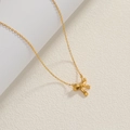 Detail of a 18K gold plated bow pendant necklace with a refined matte texture finish - Gold-Frosted Bowknot Pendant