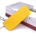 Detail of bright yellow PU leather glasses pouch with fine stitching on vintage books - Yellow