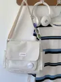 Japanese style beige messenger bag with colorful badges and LIPANO logo detail - Off White