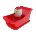 Wind-up Christmas Santa toy on a red plastic sleigh for holiday gifts and party favors - Santa in Boat Red
