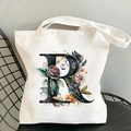 White canvas tote bag featuring a vintage floral letter R print on a metal chair - Letter R / 35*40cm