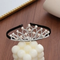 Detailed view of silver crown headband featuring sparkling rhinestones and elegant pearls - Heart Crown