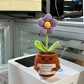 Handmade crochet purple flower in orange pot with a Spanish gratitude card on desk - Small Purple Flower 1