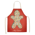 Detail of red Christmas apron with gingerbread man cutout and festive holiday patterns - A0001-20 Red Gingerbread Man
