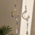 Detail of crescent moon suncatcher with blue crushed stones and faceted crystal prisms - Lapis Lazuli
