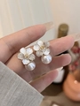 Macro shot of gold flower earrings with white pearls and sparkling crystal details - Enamel Flower Pearl Rhinestone Drop Earrings (37#)