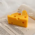 Handmade yellow cheese shaped scented candle on vintage book with VISSY tag - Large Cheese